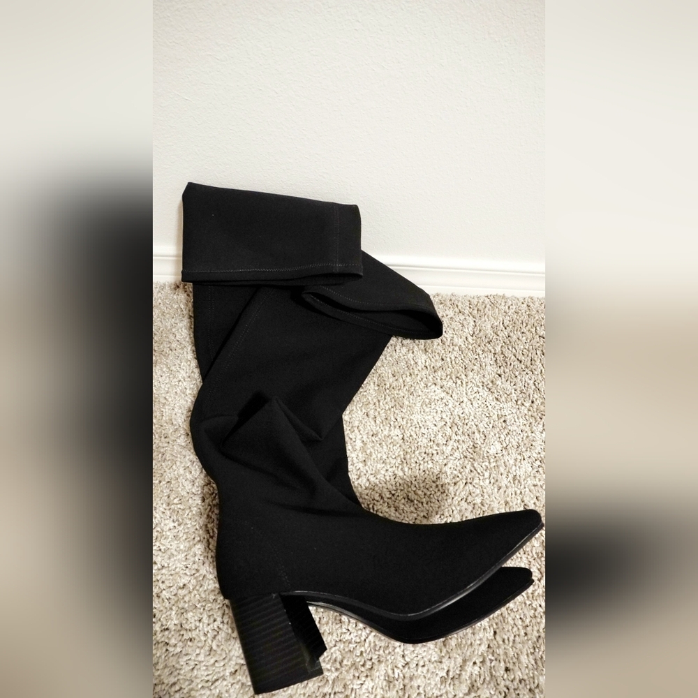 Black stretch knee-high sock boots with a blockheel.